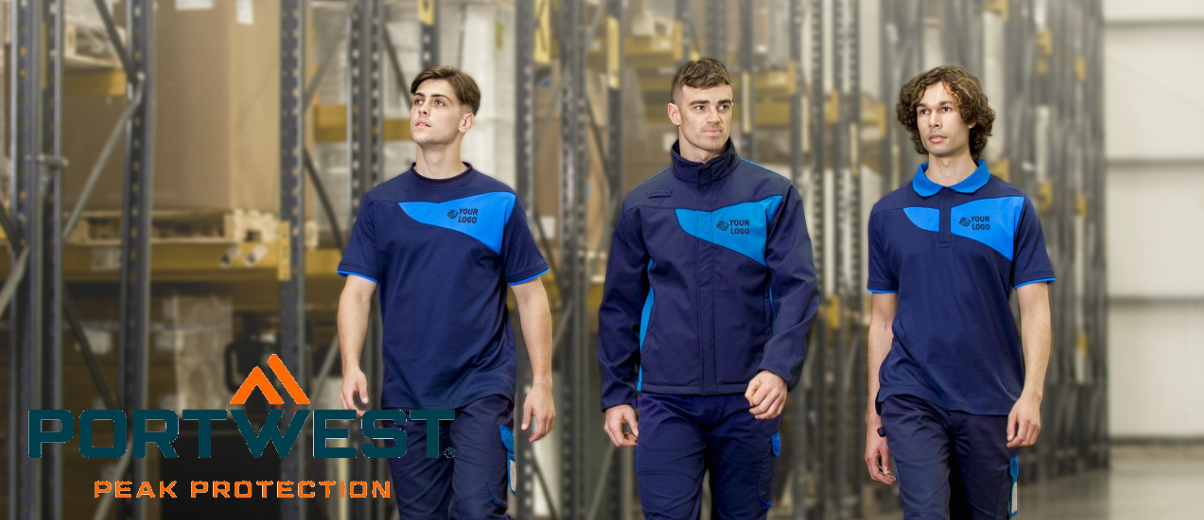 Three young men in uniform work clothes in different shades of blue. Storage shelves can be seen in the background and the logo of the workwear manufacturer Portwest can be found in the lower left area of the image.