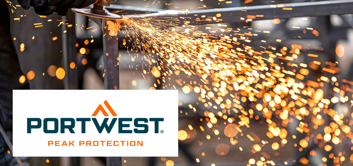 Sparks caused by sawing with a Flex saw. In the background of the image, you can see a blurred iron grate; in the lower left corner of the image, you can see the white logo of the manufacturer Portwest in blue and orange lettering.