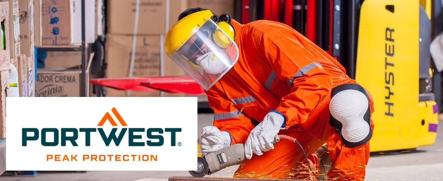 Workers in orange high-visibility clothing in front of a warehouse background. He has a welding machine in his hand and is welding something that is lying on a wooden pallet. In the left area of the image is the blue and orange Portwest logo. A link to our selection of different overalls is provided.