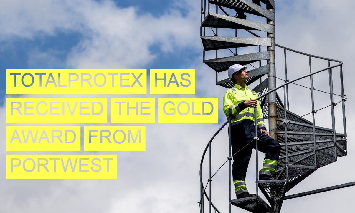 Worker in yellow warning clothing climbs a spiral staircase and looks at the sky. A blue sky with white clouds can be seen in the background. The image is captioned 'Totalprotex has received the Gold Award from Portwest'.